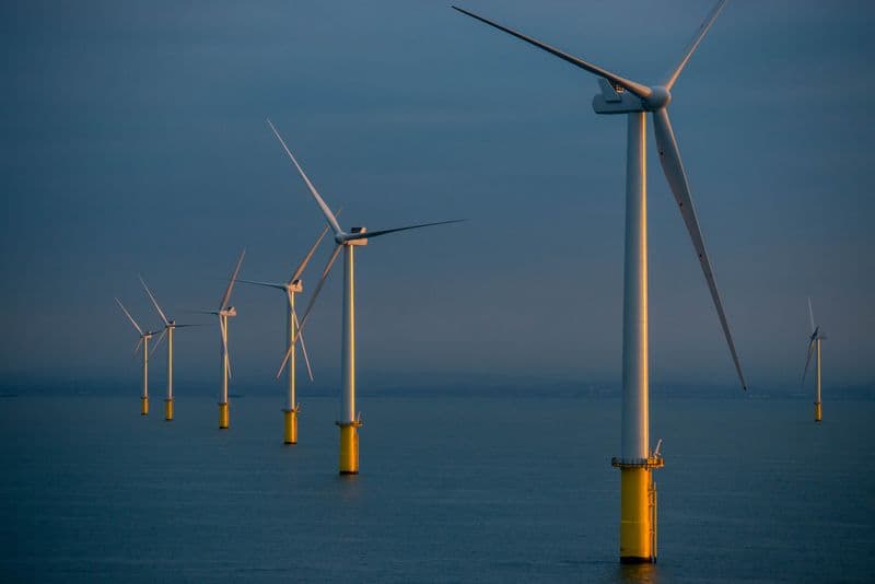 A photo of the Rampion offshore wind farm off Brighton, UK, in sunrise